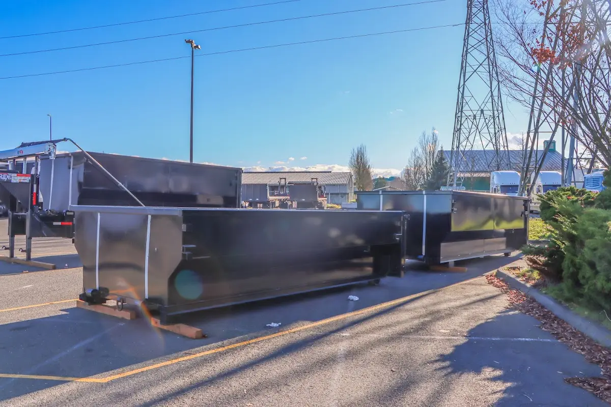 Roll-off dumpster ready for waste disposal at job site for Concrete Dumpster Rental in Coconut Creek